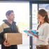 Courier handing package to recipient